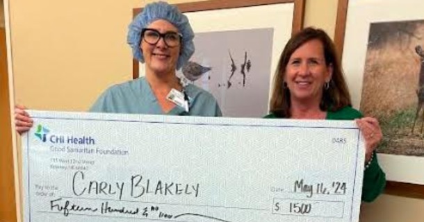 Last year, Carly Blakely, RN (left) was one of 26 recipients to receive a scholarship from Good Samaritan Foundation to help further her health care education. Foundation Director Cindi Richter (right) presented Blakely with a ceremonial check last May.